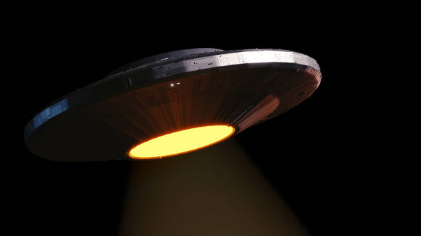 istock UFO, alien spaceship with tractor beam, flying saucer isolated on empty black background 1189397951