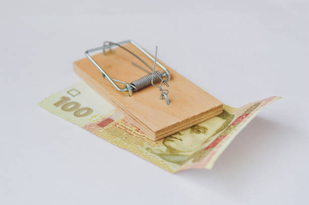 istock Ukrainian hryvnias and mouse trap 1189398256