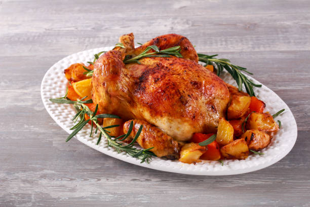 istock Roast whole chicken with vegetables and rosemary 1189400920