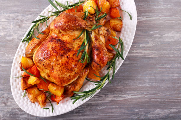 istock Roast whole chicken with vegetables 1189401475