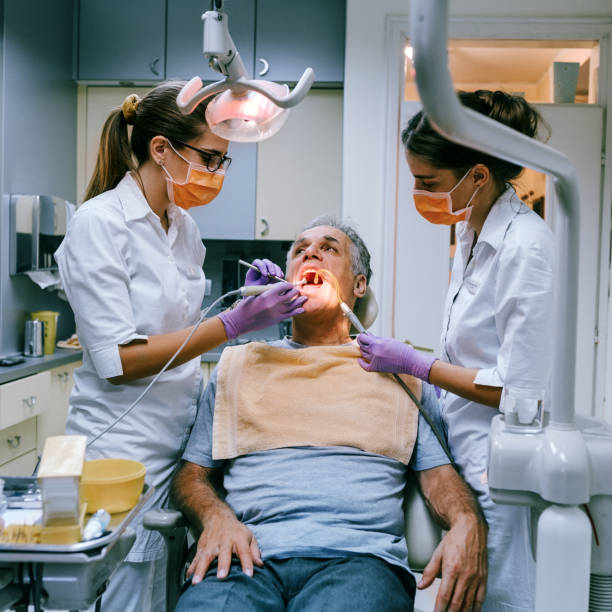 istock Mature man at the dentist 1189401623