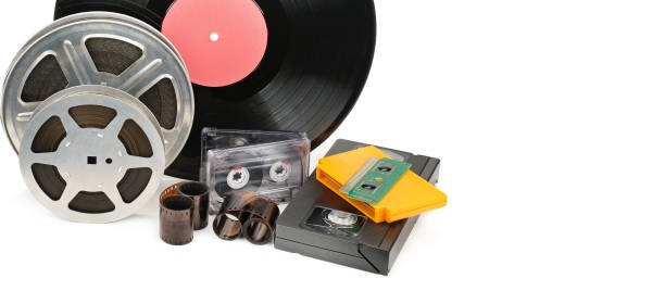 Vinyl record, video and audio cassettes isolated on white background. Retro equipment. Vinyl record, video and audio cassettes isolated on white background. Retro equipment. Free space for text. Wide photo . spool photos stock pictures, royalty-free photos & images