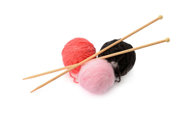 istock Multi-colored balls and knitting needles isolated on a white background. 1189401702