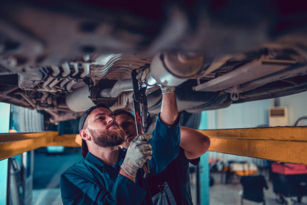 istock Setting Up New Exhaust System For The Car 1189402752
