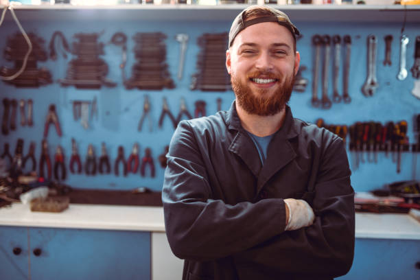 istock Handsome Male Mechanic And His Nice Shop 1189402855