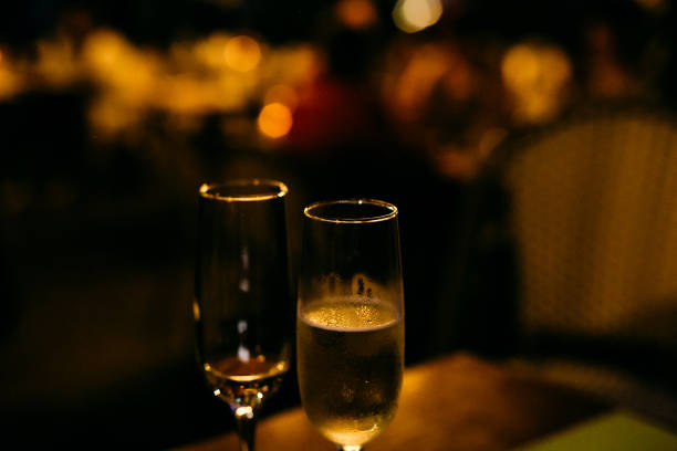 istock two glasses champagne holiday background with garlands 1189402992