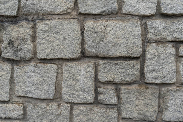 istock Texture of the granite stone wall for background 1189403895