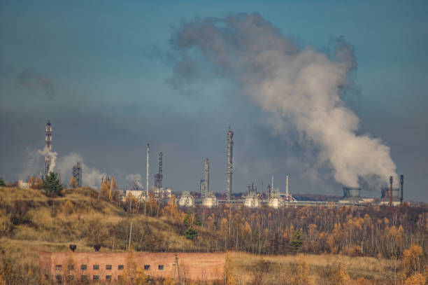 istock Factories in an industrial area among the forest 1189404089