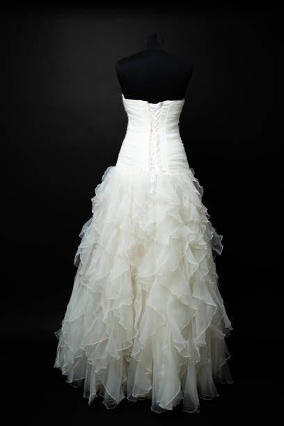 istock white wedding dress on black background in studio 1189407986