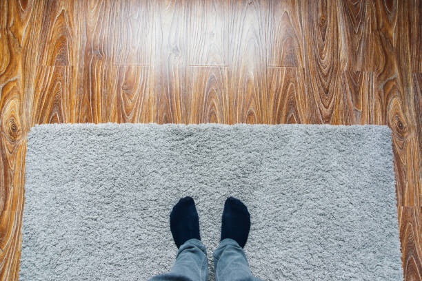 istock Laminate parquete floor. Light wooden texture. Beige soft carpet. Warm interior design 1189408037