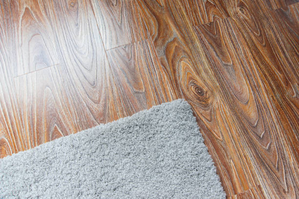 istock Laminate parquete floor. Light wooden texture. Beige soft carpet. Warm interior design 1189408079