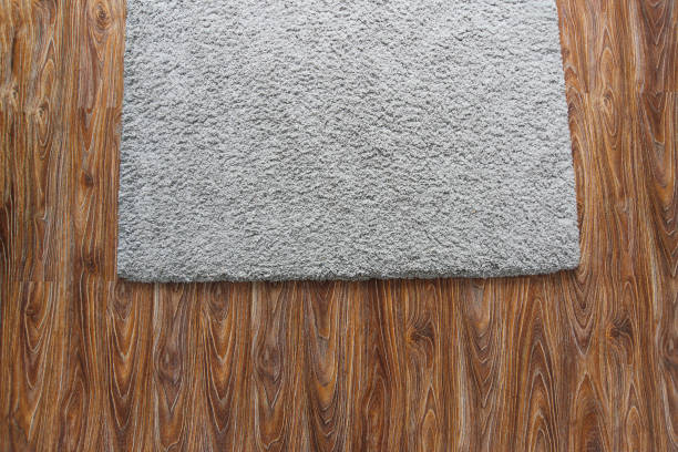 istock Laminate parquete floor. Light wooden texture. Beige soft carpet. Warm interior design 1189408086