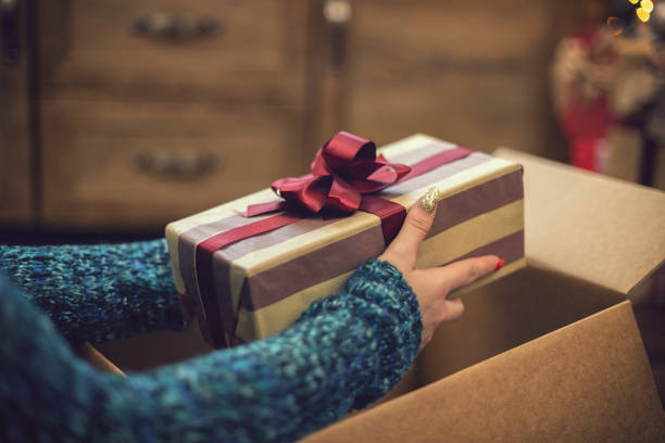 istock Young girl getting parcel on Christmas 1189412439