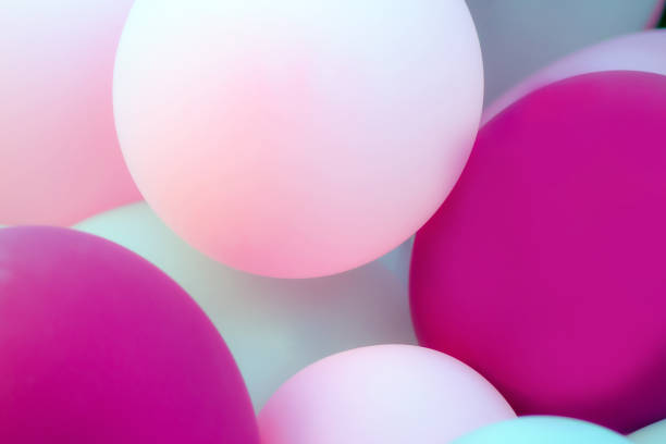 istock colored balloons. light, pink, purple. nice soft colors. decorative wall as background 1189414126