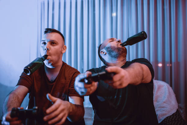 istock Friends Having Some Beer And Playing Video Games 1189416012