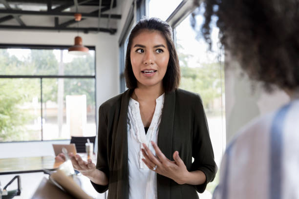 istock Upset businesswoman discusses concerns 1189419321