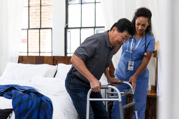 istock Senior man uses walker while recovery from surgery 1189419511
