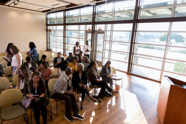 istock Group of diverse people attend a conference or expo 1189420944