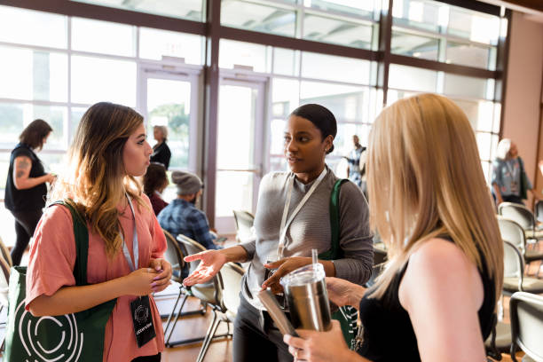 istock Business conference attendees discuss the conference 1189420953