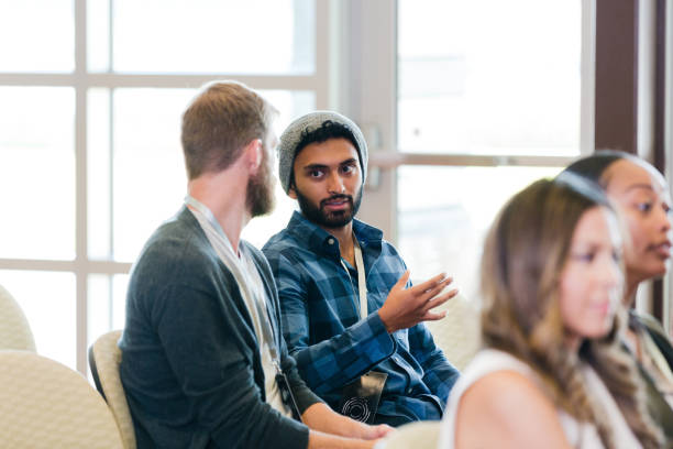 istock Serious male millennial attends conference 1189420961