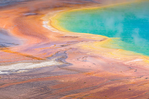 istock yellowstone; multicolored; lake; spring; chromatic; usa; vivid; hot; colors; bacteria; algae; scenery; turquoise; steaming; landscape; volcanic; vista; primsatic; travel; detail; blue; orange; geyser; wyoming; grand; basin; pool; nature; natural; large; g 1189421106
