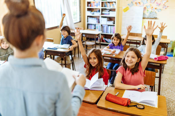 istock Elementary education in Latin America - teacher sharing knowledge with school children 1189422647