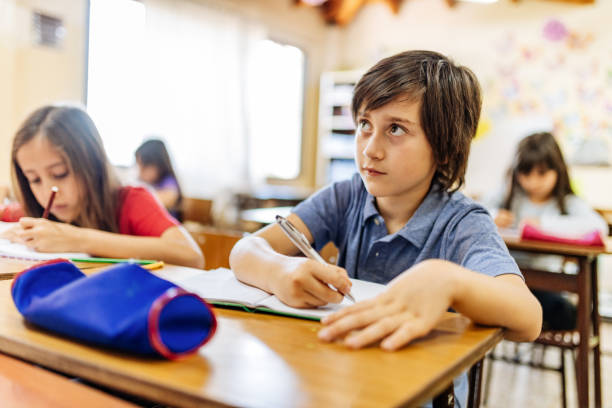istock Elementary education in Latin America - school children having test 1189422680