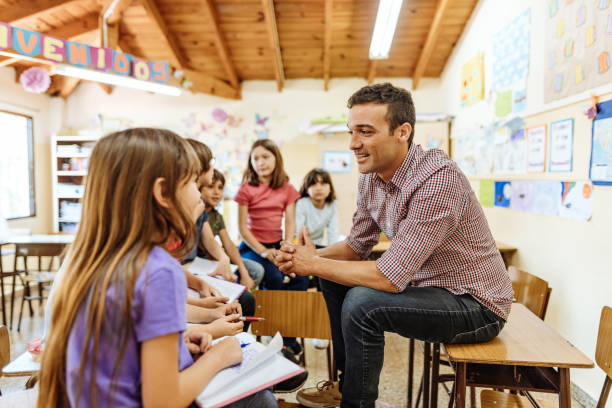 istock Elementary education in Latin America - brainstorming with teacher after the class 1189423442