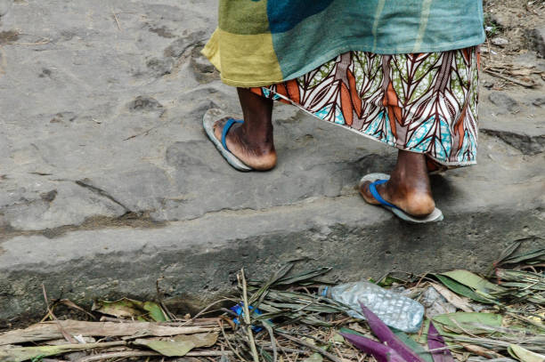 Walking woman in Bacongo Republik of Congo. stock photo