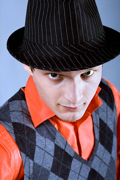 Portrait of the young man in a hat stock photo