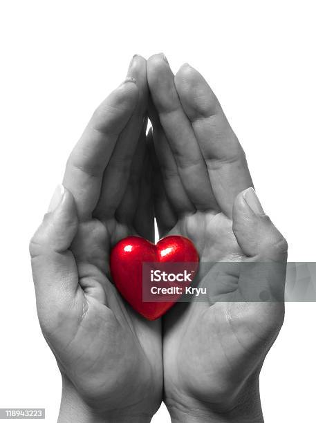 Closeup Of Black And White Hands Holding Red Heart Stock Photo - Download Image Now