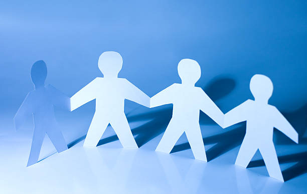 istock Paper little men holding hands 118943435