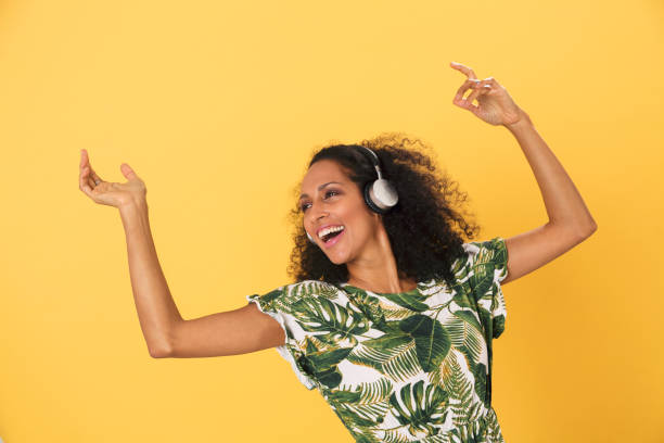 colombian woman listening to music - funky people cool women imagens e fotografias de stock