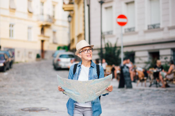 istock Tourist holding city map 1189436035