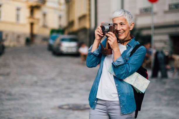 istock Woman is smiling and photographing 1189436054