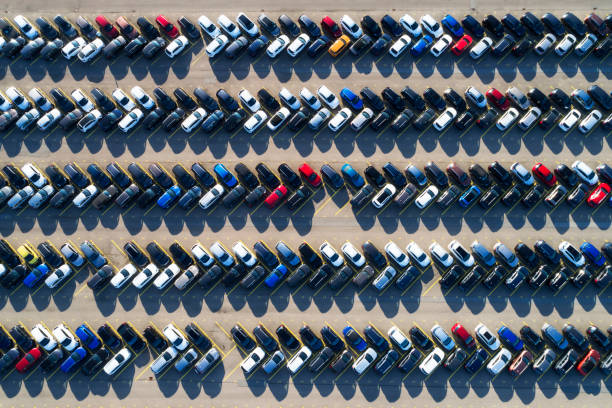 Rows of cars in a large parking lot, aerial view Aerial photograph of rows of cars parked in a large parking lot. full stock pictures, royalty-free photos & images