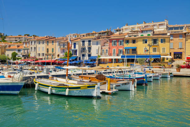 Colorful traditional houses and boats in the port of Cassis town, France stock photo