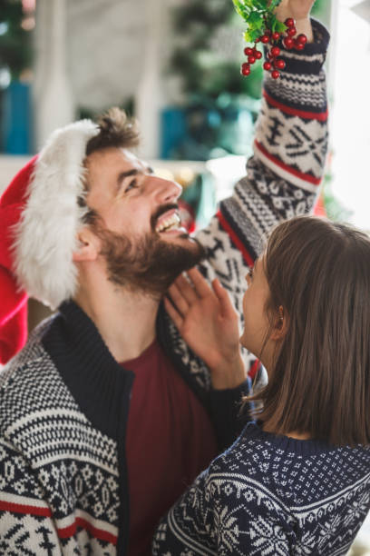 istock Young couple under the mistletoe 1189444817