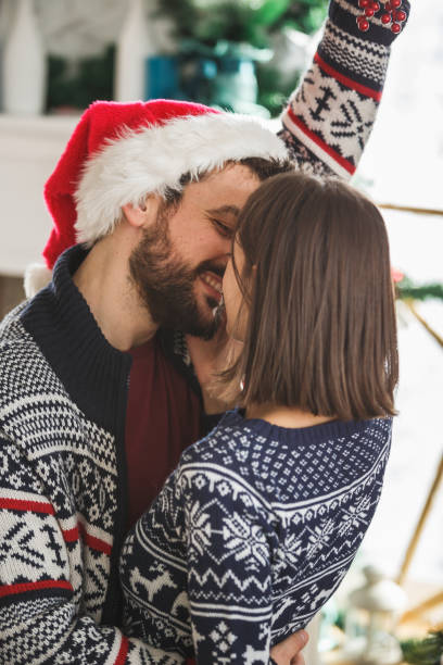 istock Couple kissing under the mistletoe 1189444819
