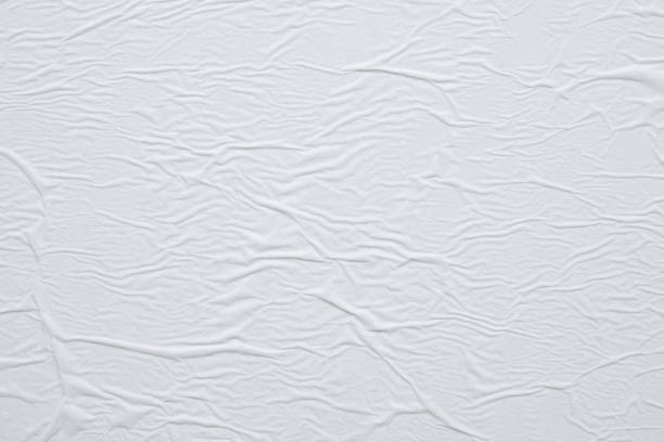 istock Blank white crumpled and creased paper poster texture background 1189444941