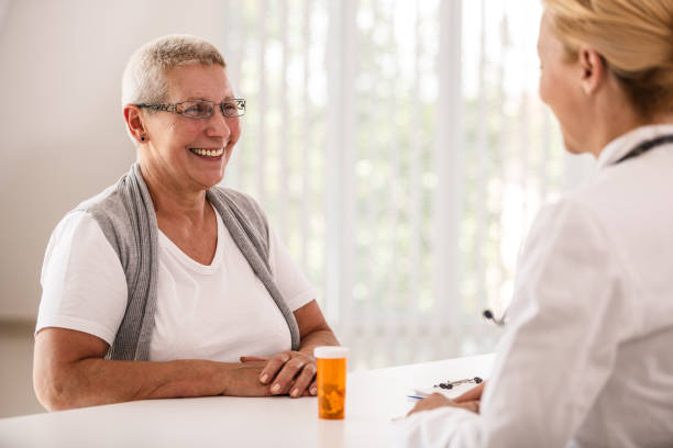 istock Doctor talking to her senior patient about medication 1189445013