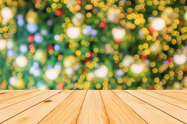 istock Empty wood table top with Abstract blur Christmas tree with decoration bokeh light background for product display 1189446150
