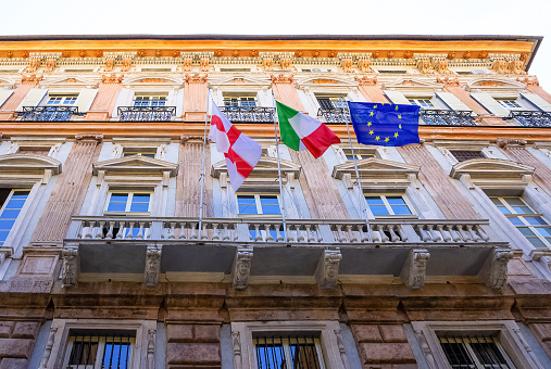 Italian and European Union flag on government building. Rome, Italy.