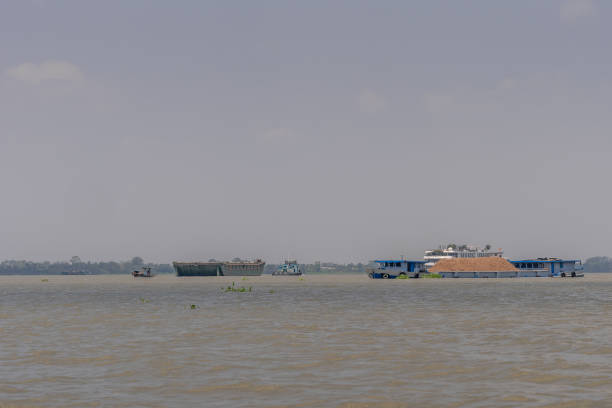 Wooden Mekong River Boat with eyes painted on the bow of the boat