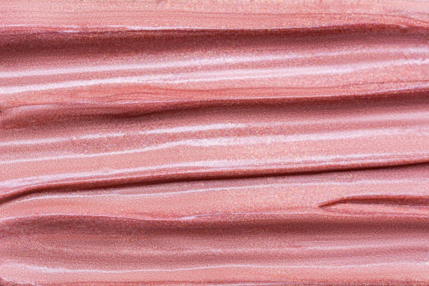 istock Texture of lip gloss. Smudged makeup product sample. Sparkling background. 1189450500