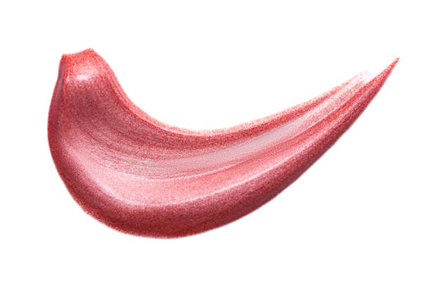 istock Lip gloss isolated on white. Smudged pink makeup product sample. 1189450510