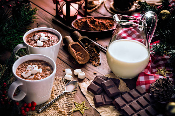 istock Christmas table setup with homemade chocolate mug, marshmallows on rustic table 1189458890