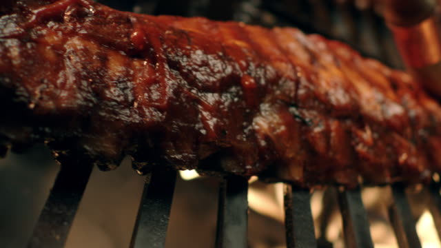Ribs on flaming barbecue grill