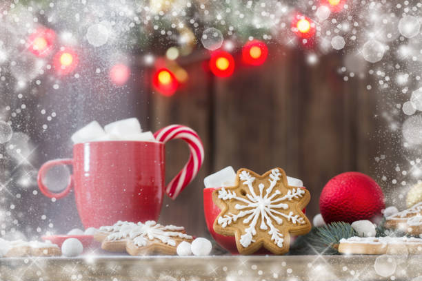 istock Christmas cookies on wooden table in kitchen 1189465341