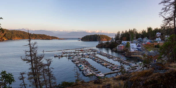 Vancouver Island, BC Sooke, Vancouver Island, British Columbia, Canada. Beautiful panoramic view of a residential neighborhood with marina during a summer sunset. port renfrew stock pictures, royalty-free photos & images